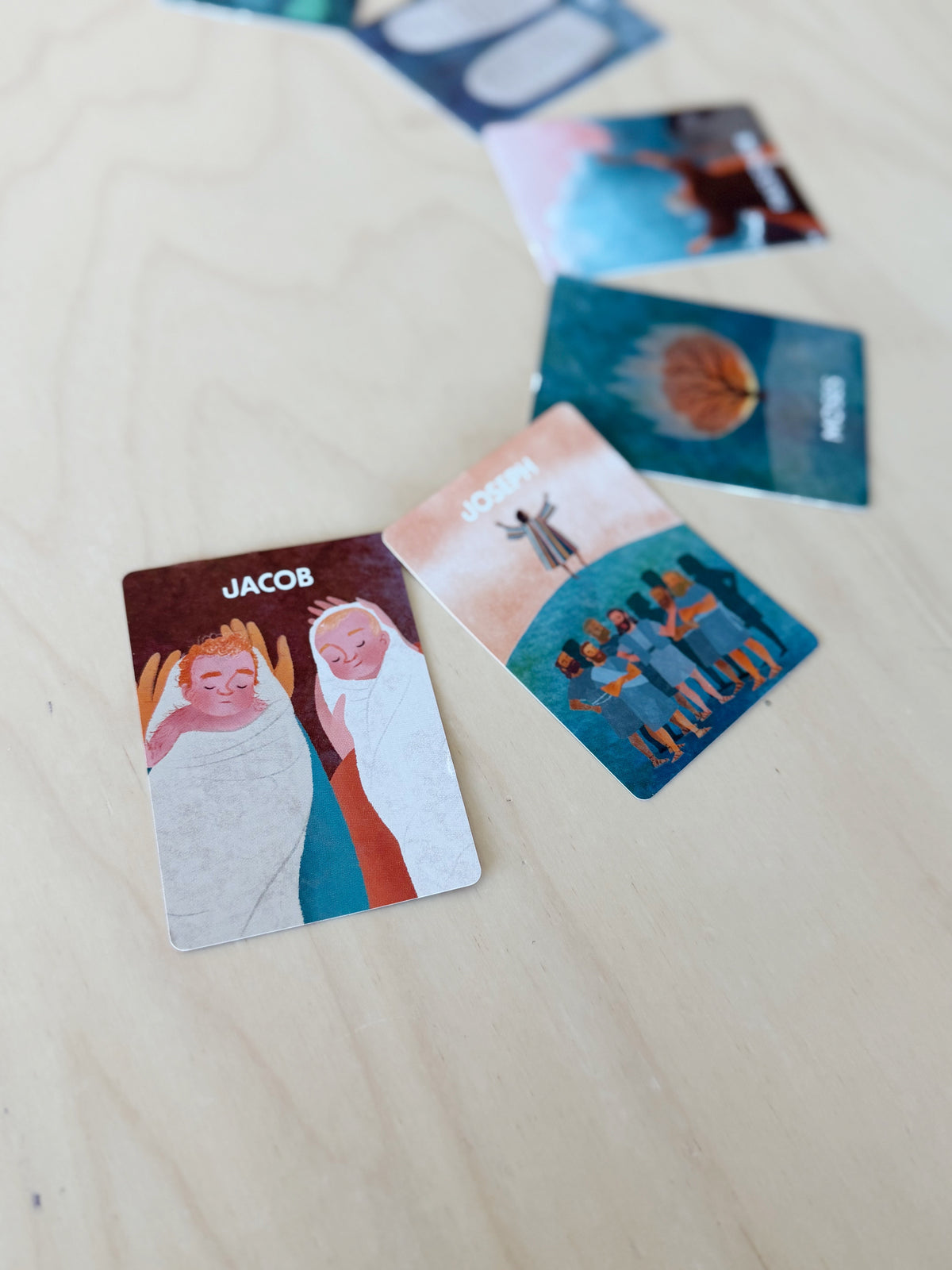 Illustrated God’s Story, Our Story Bible cards spread on a table